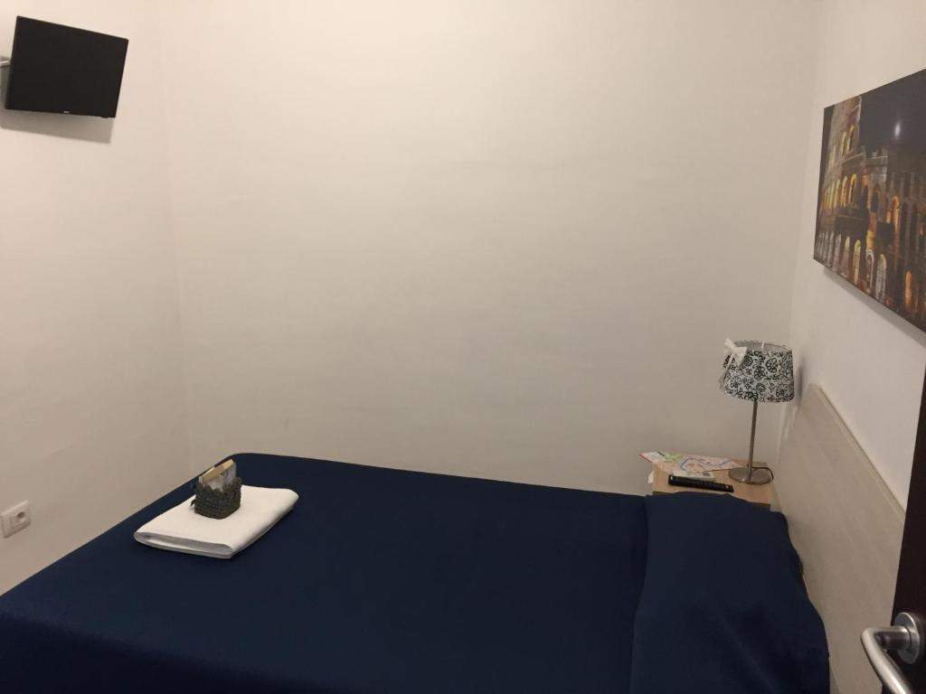 A bed or beds in a room at Aquarius Rome
