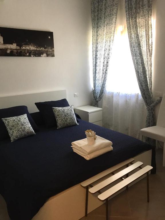 A bed or beds in a room at Aquarius Rome