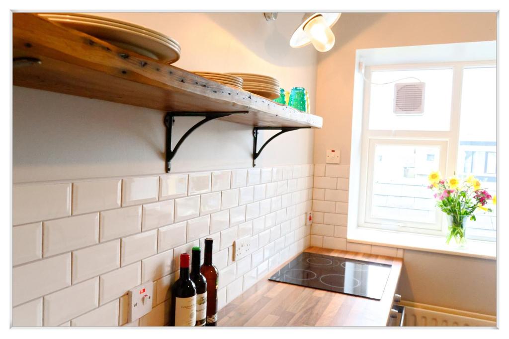 Kuchyň nebo kuchyňský kout v ubytování Harbour Bar Apartment