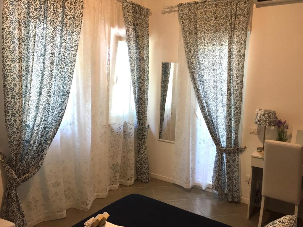 A bed or beds in a room at Aquarius Rome