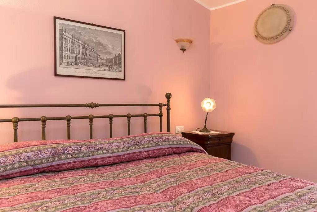 Postel nebo postele na pokoji v ubytování Villa Mereghetti