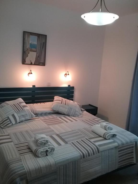 Postel nebo postele na pokoji v ubytování Mouria Hotel