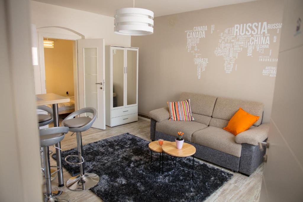 a living room with a couch and a table at Apartment Impression in Osijek