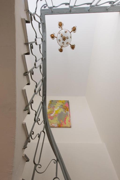 a stuffed animal on a wall next to a painting at Castello Boutique Rooms in Kavála