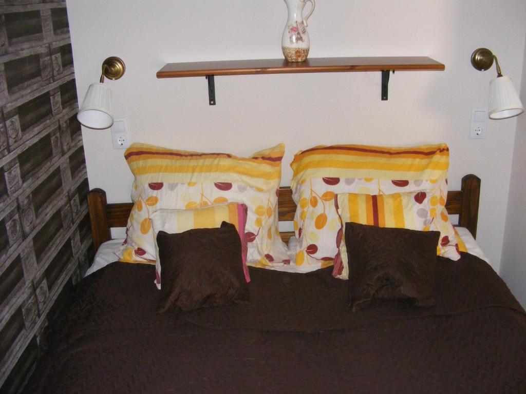 A bed or beds in a room at A bástya árnyéka