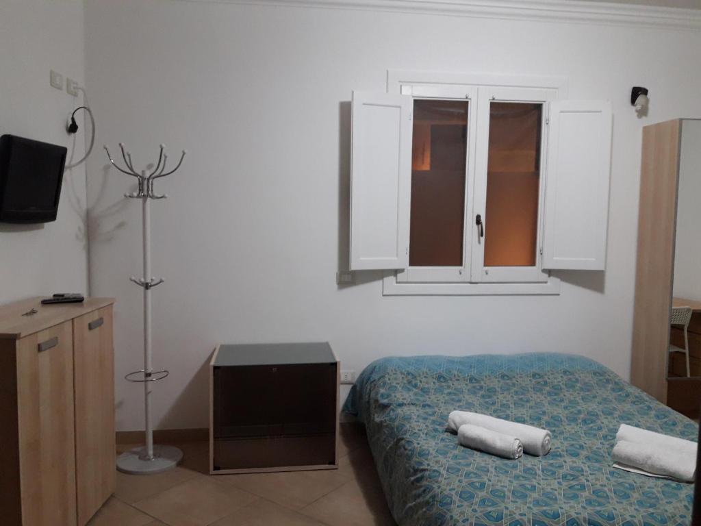 Postel nebo postele na pokoji v ubytování Le Terrazze B&B Manduria