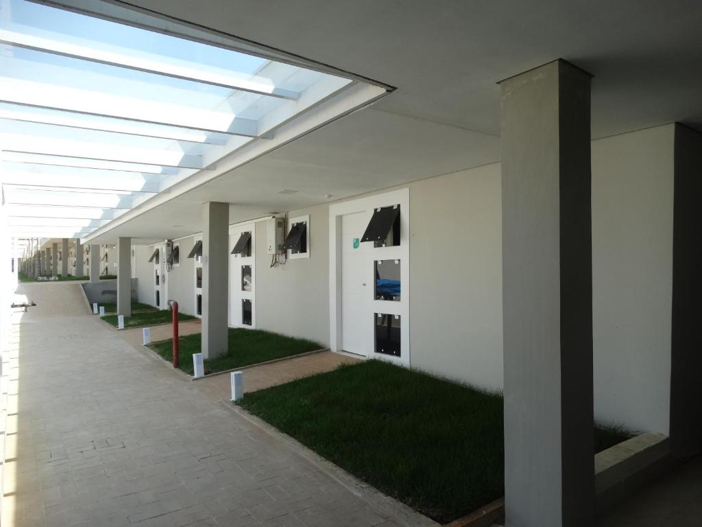 a hallway of a building with green grass at Cynn Hotels in São José dos Campos