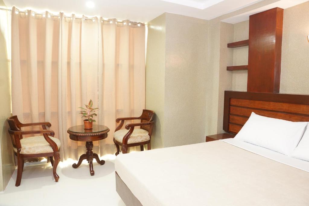 Postel nebo postele na pokoji v ubytování Hotel Rodolfo