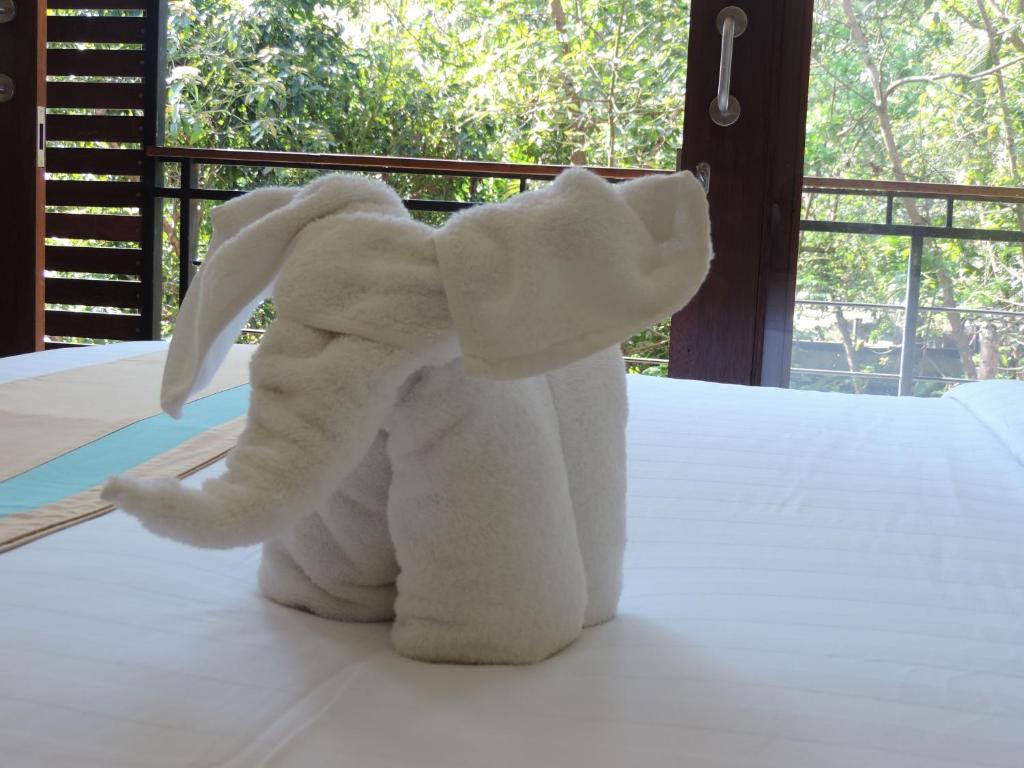 Postel nebo postele na pokoji v ubytování Kencana Ubud by Mahaputra