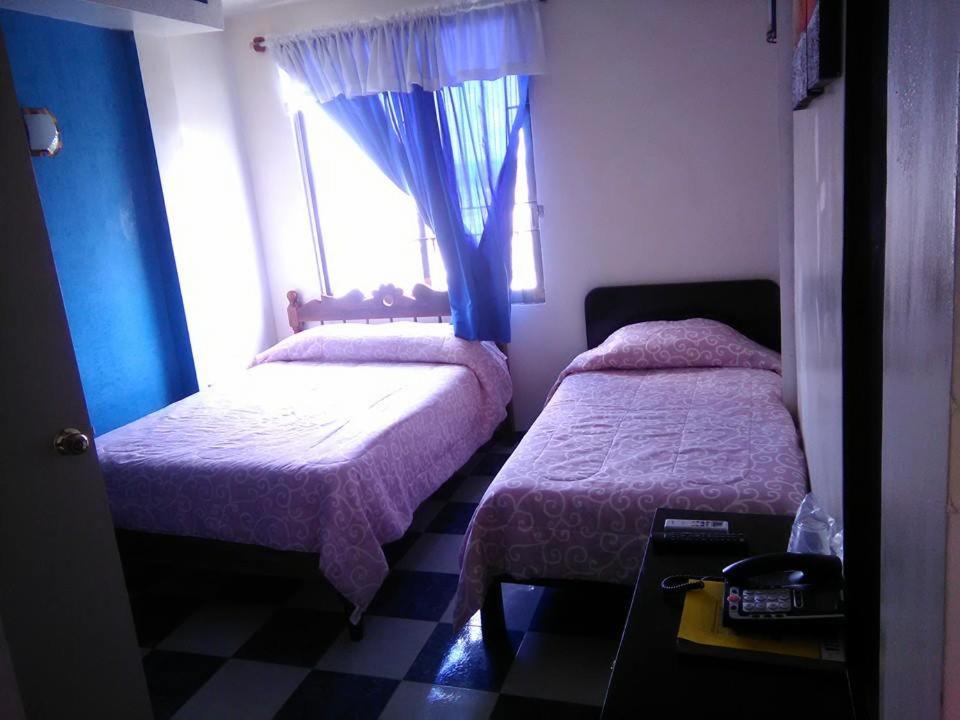 Postel nebo postele na pokoji v ubytování Hotel Marina Campeche
