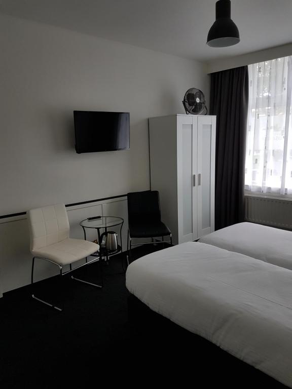 Een bed of bedden in een kamer bij Stad & Strandhotel Elisabeth