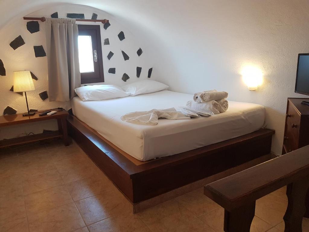 Postel nebo postele na pokoji v ubytování Abelonas Village