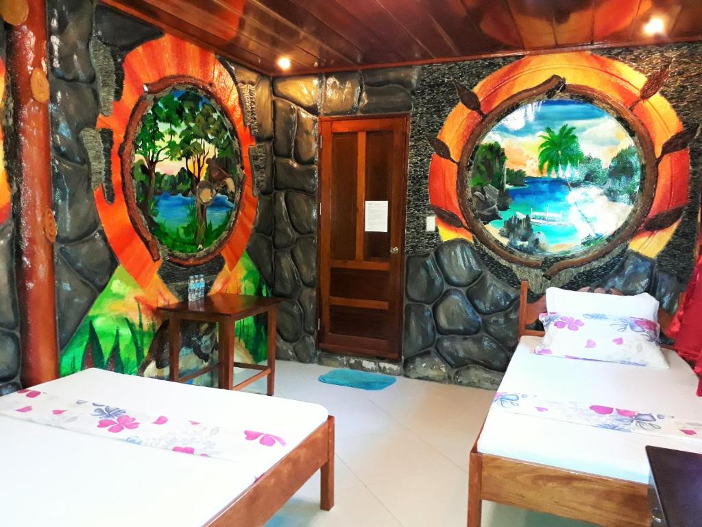 Postel nebo postele na pokoji v ubytování Ausan Beach Front Cottages