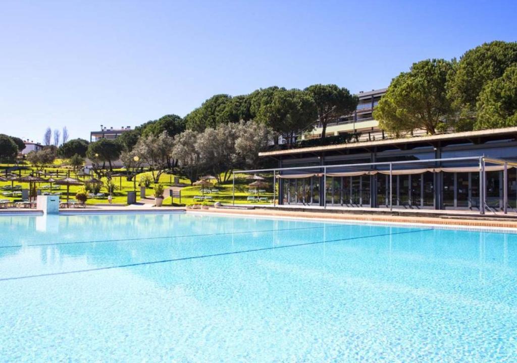 a large swimming pool in front of a building at Marina Park - Martine et Thierry in Lagos