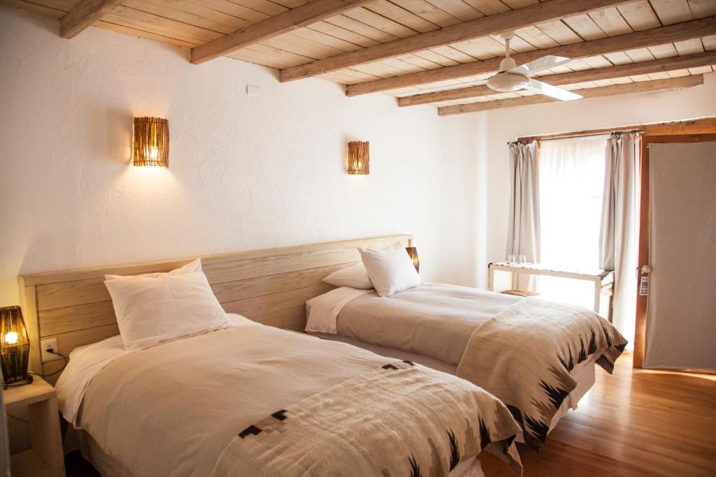 Postel nebo postele na pokoji v ubytování Terrantai Lodge