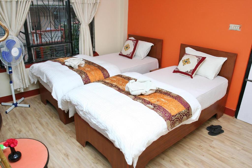 Postel nebo postele na pokoji v ubytování Thamel Backpackers Home