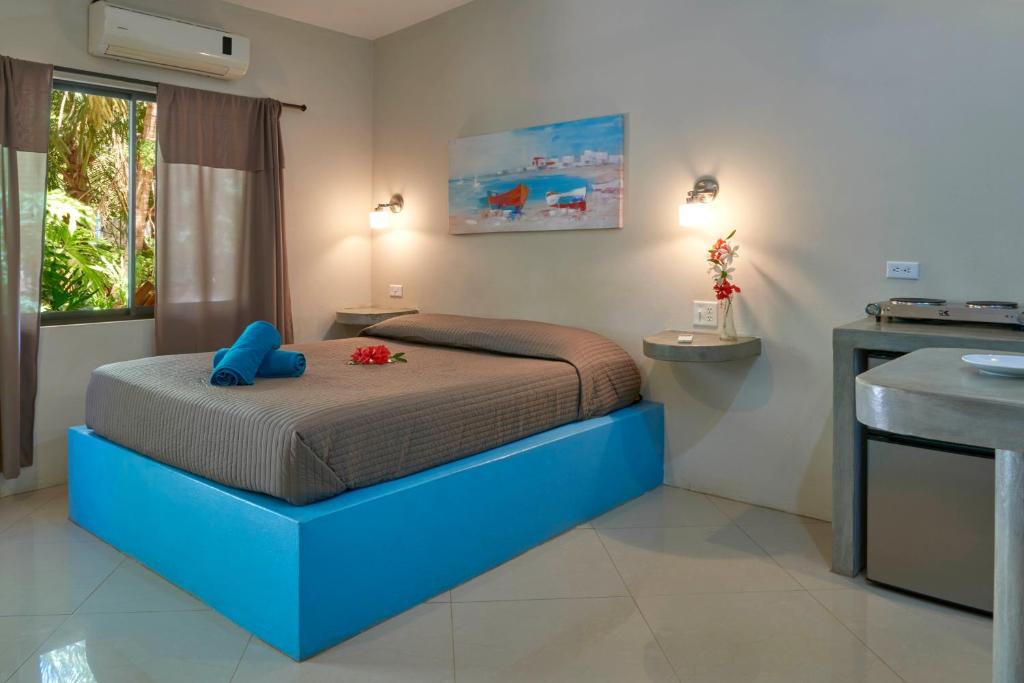 Postel nebo postele na pokoji v ubytování Playa Negra Surf Lodge