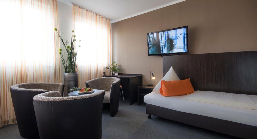 Postel nebo postele na pokoji v ubytování GS Hotel