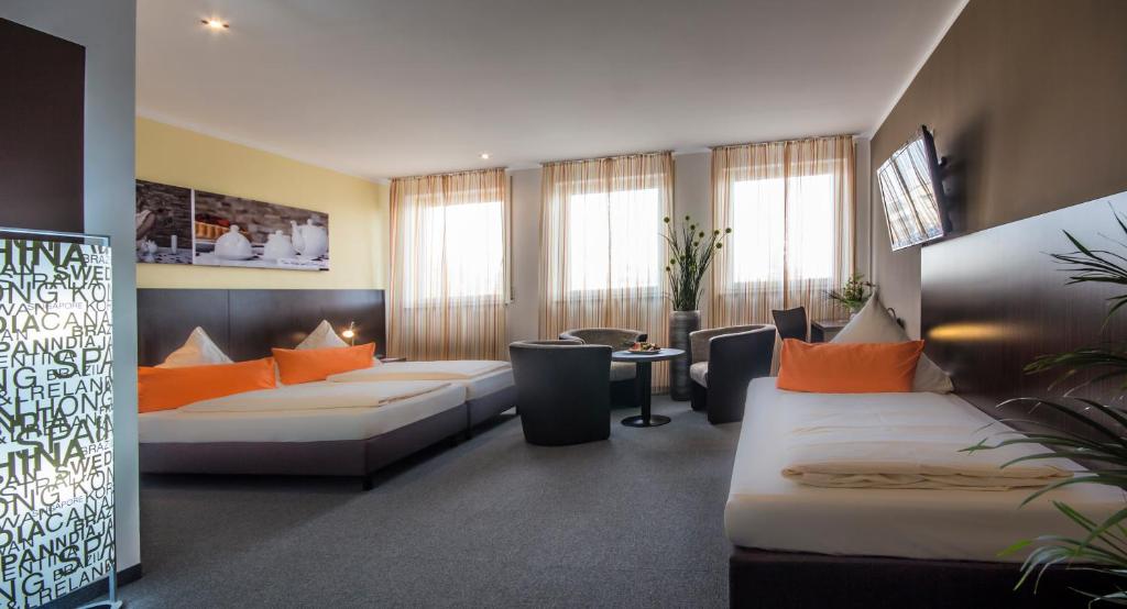 Postel nebo postele na pokoji v ubytování GS Hotel