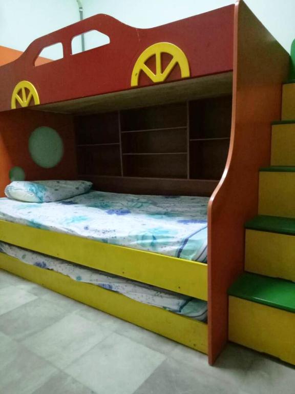 Postel nebo postele na pokoji v ubytování Farzai Homestay
