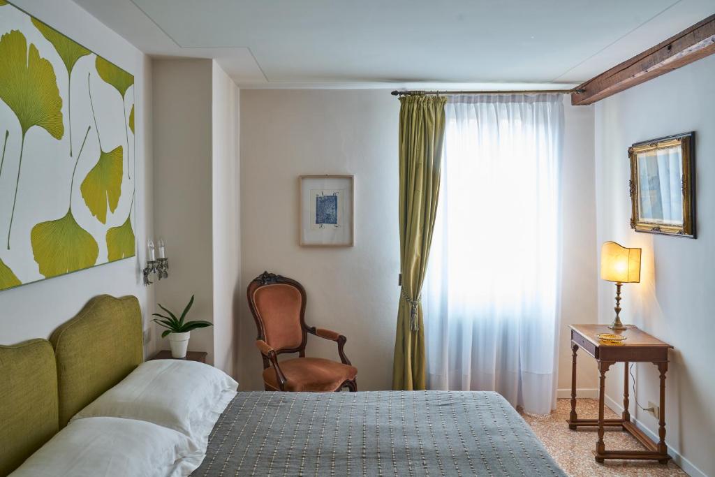 Postel nebo postele na pokoji v ubytování Campiello Zen B&B