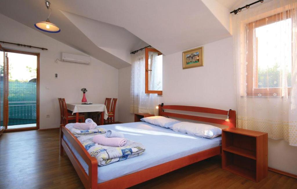 Postel nebo postele na pokoji v ubytování Studio Apartments Izabela