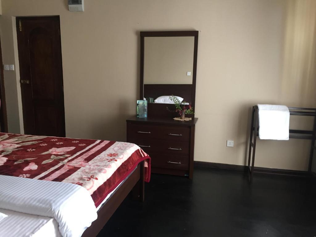 Postel nebo postele na pokoji v ubytování Perera Homestay