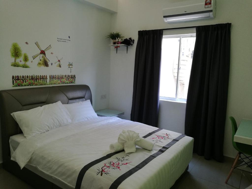 Postel nebo postele na pokoji v ubytování D' Cozy Inn