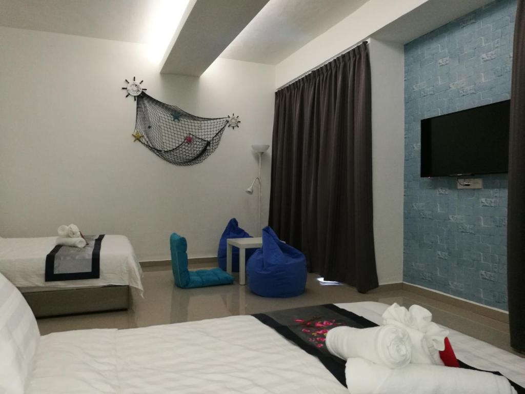 Postel nebo postele na pokoji v ubytování D' Cozy Inn