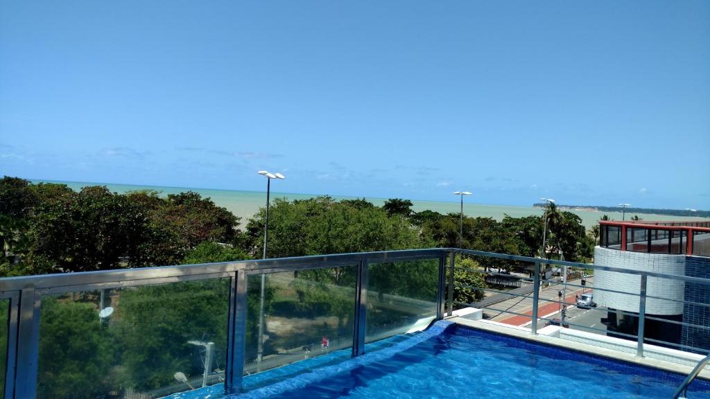 a swimming pool on the roof of a building at Israel Flat in João Pessoa