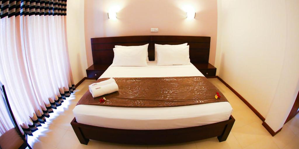 Postel nebo postele na pokoji v ubytování Hotel Shanelo