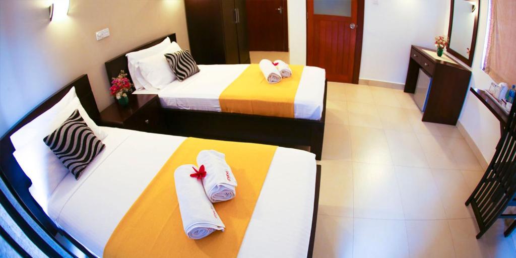 Postel nebo postele na pokoji v ubytování Hotel Shanelo
