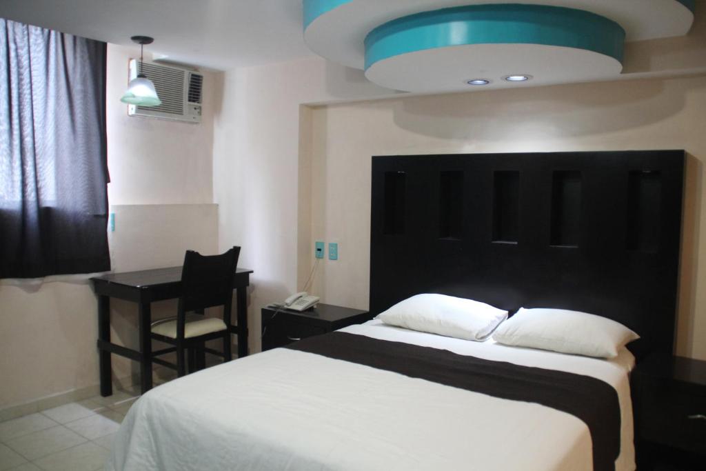 Postel nebo postele na pokoji v ubytování Hotel San Rafael