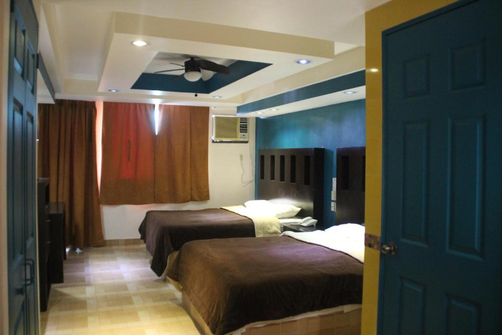 Postel nebo postele na pokoji v ubytování Hotel San Rafael