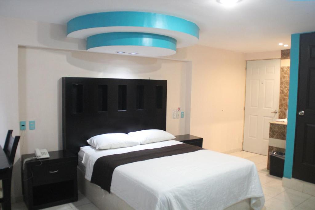 Postel nebo postele na pokoji v ubytování Hotel San Rafael