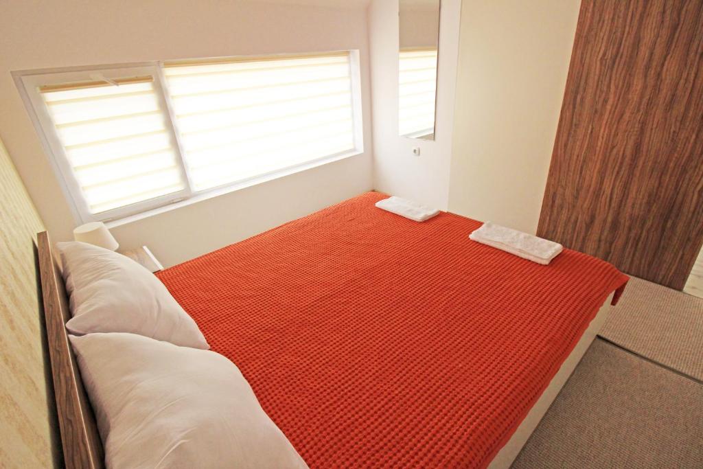 Postel nebo postele na pokoji v ubytování Lilly Apartments