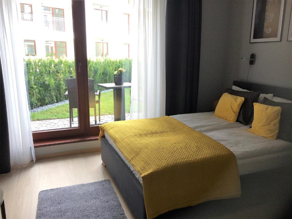 Posteľ alebo postele v izbe v ubytovaní Apartament Nowa Motława & SPA