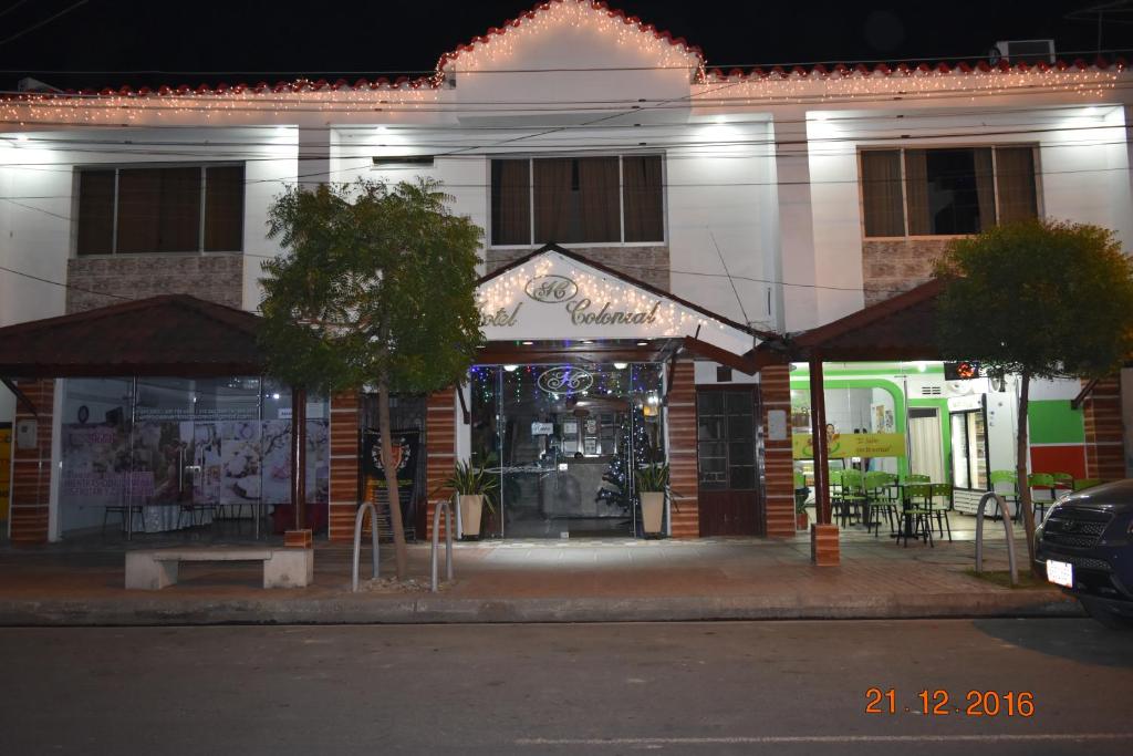a store front of a building at night at Hotel Arauca Colonial in Arauca