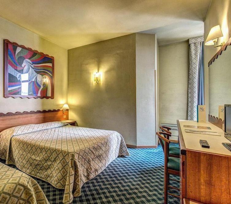 Postel nebo postele na pokoji v ubytování Hotel Europa