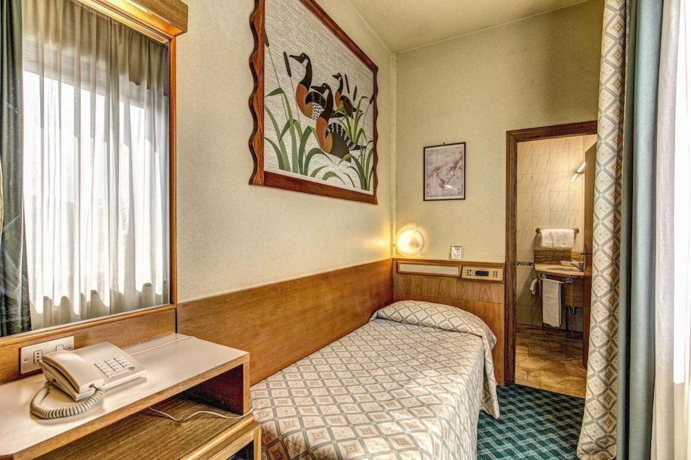 Postel nebo postele na pokoji v ubytování Hotel Europa