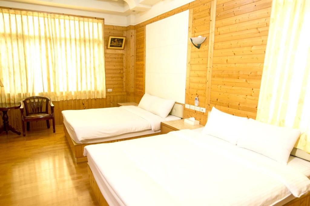 Postel nebo postele na pokoji v ubytování Yi Xin Homestay