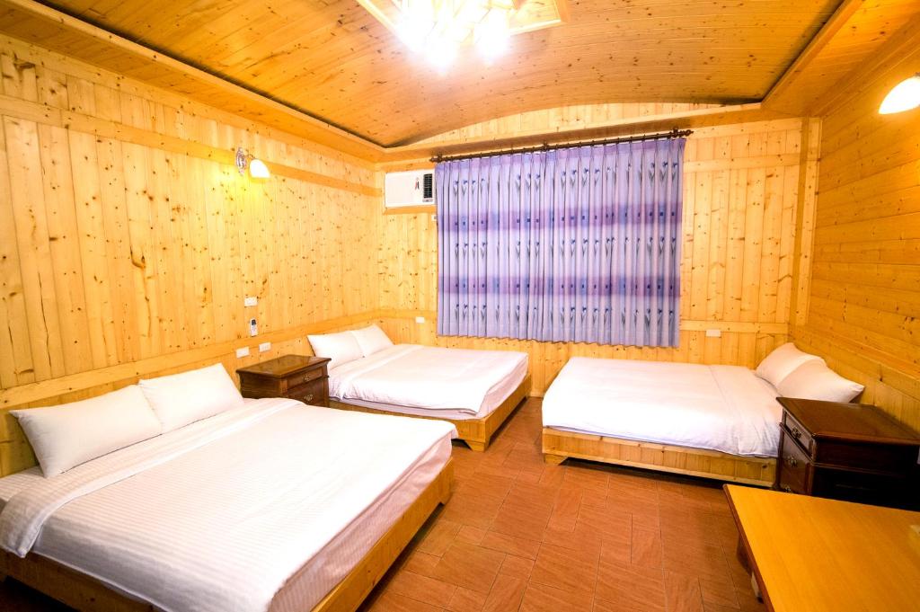 Postel nebo postele na pokoji v ubytování Yi Xin Homestay