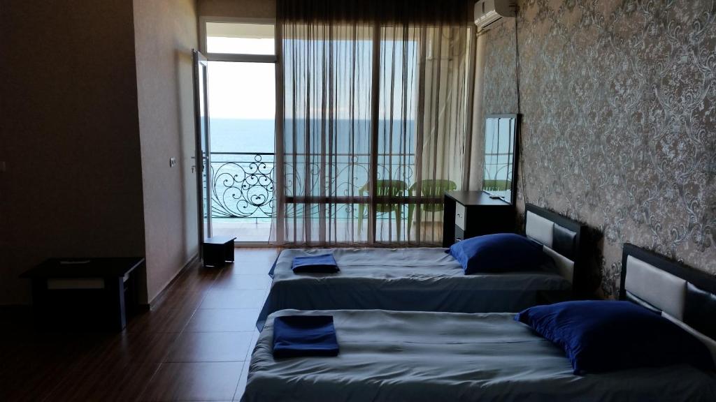 Postel nebo postele na pokoji v ubytování Hotel Kvariati Nugo