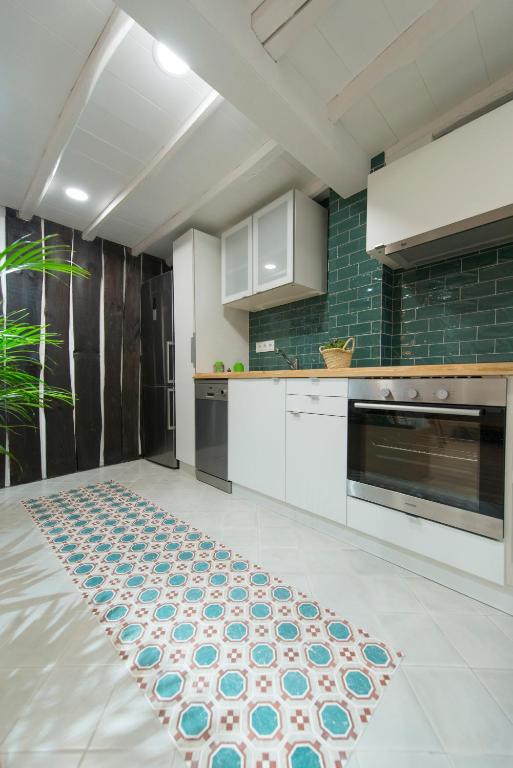 Kuchyň nebo kuchyňský kout v ubytování Apartamento Luscofusco