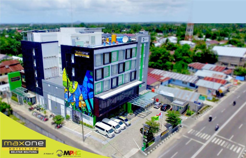 a model of a city with a large building at MaxOneHotels at Belstar Belitung in Tanjungpandan
