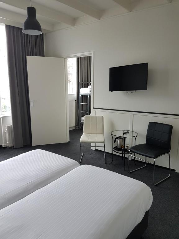 Een bed of bedden in een kamer bij Stad & Strandhotel Elisabeth