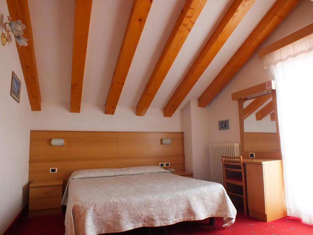 Postel nebo postele na pokoji v ubytování Hotel Orso Grigio