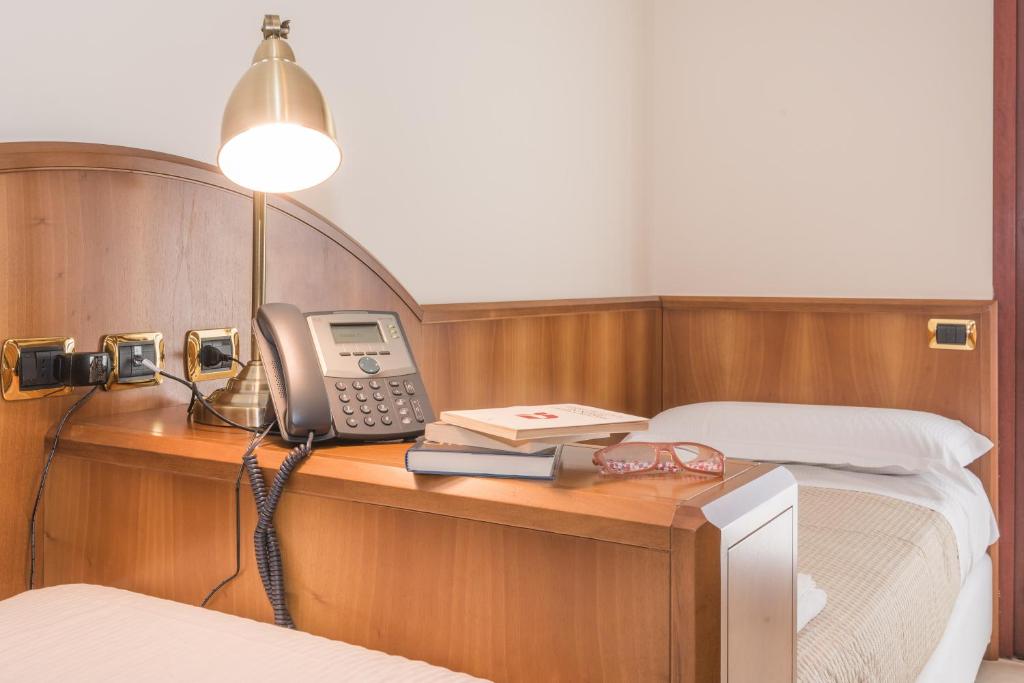 Posteľ alebo postele v izbe v ubytovaní Albergo Villa Priula