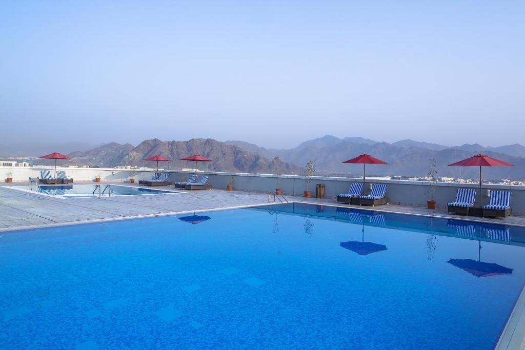 a large swimming pool on the roof of a hotel at Concorde Hotel Fujairah in Fujairah