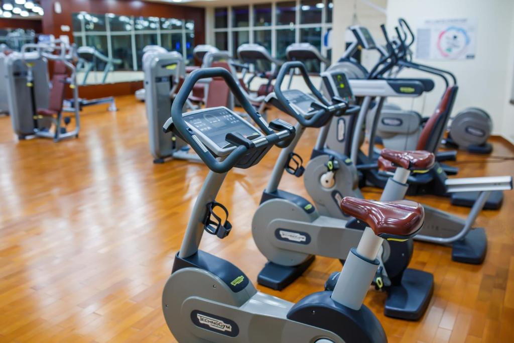 a row of cardio machines in a gym at Concorde Hotel Fujairah in Fujairah